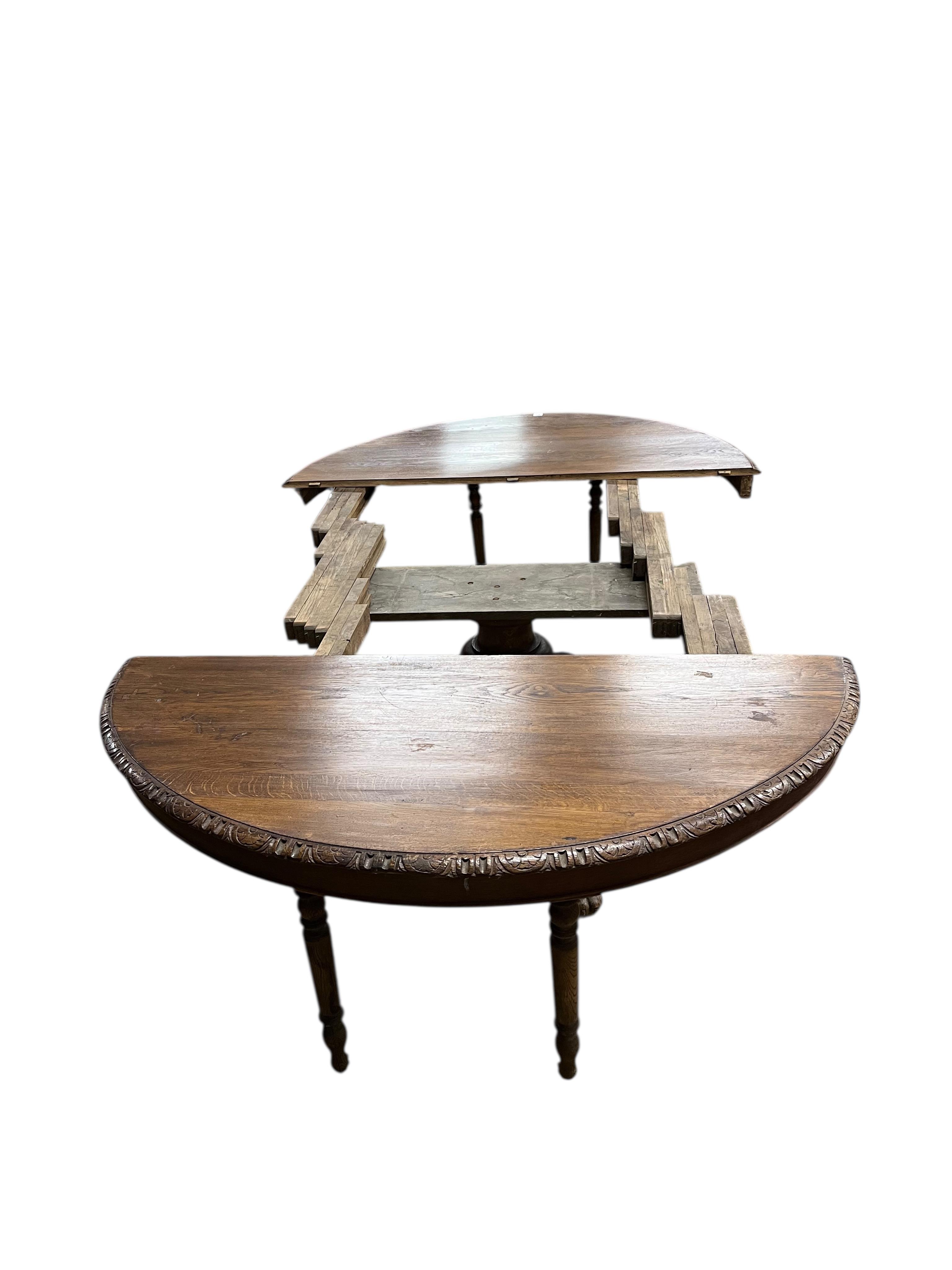 A 19th century oval oak extending dining table, (no leaves), width 142cm, depth 122cm, height 71cm